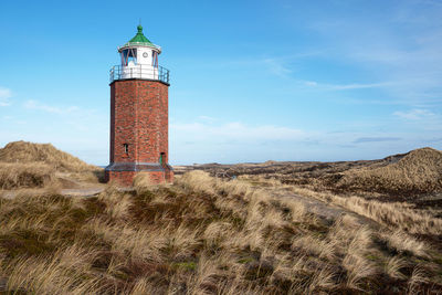 Panoramic image of kampen lighthouse against blue sky, sylt, north frisia, germany