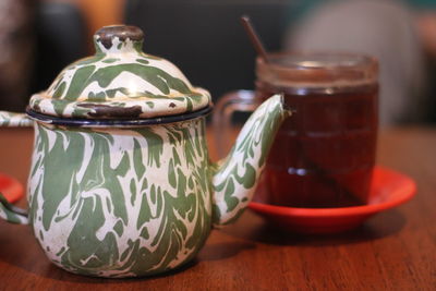 Close-up of tea in jar on table