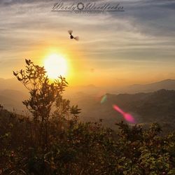 Scenic view of mountains against sky during sunset