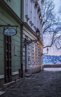 Street amidst buildings against sky