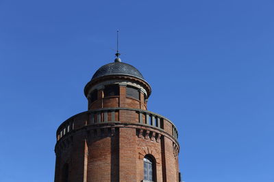 Low angle view of tower against clear blue sky