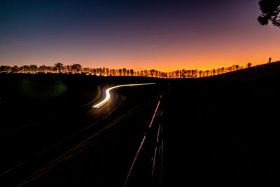 Scenic view of road against sky at night