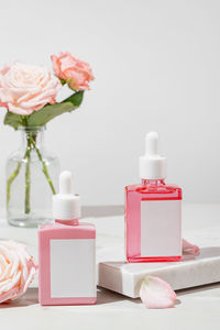 Close-up of beauty products against white background