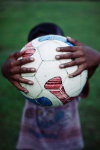 Close-up of hand holding ball