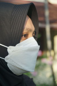 A woman wearing a mask