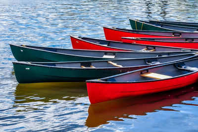 Red boat moored in lake