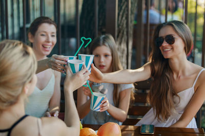 Young woman in a drinking glass