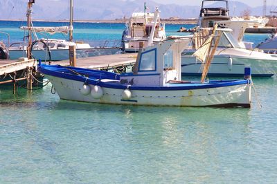 Boats moored at harbor