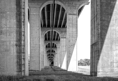 Arch bridge against building