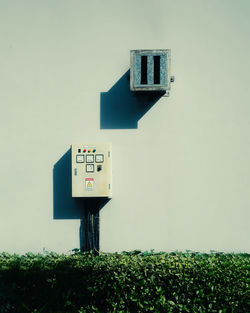 Low angle view of security camera against sky