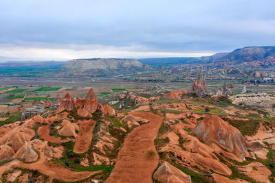 Aerial view of landscape against cloudy sky