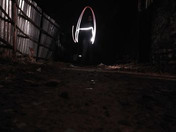 Illuminated light painting on wall at night