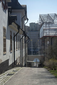 Street amidst buildings against sky