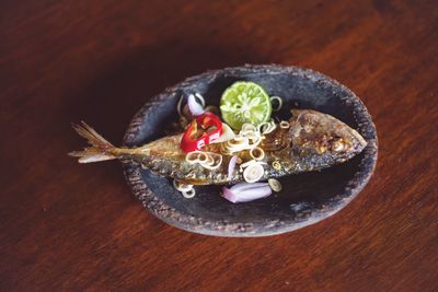 High angle view of fruit in plate on table