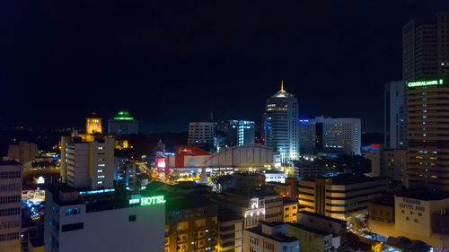 High angle view of illuminated buildings in city at night