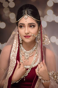 Beautiful young woman wearing jewelry