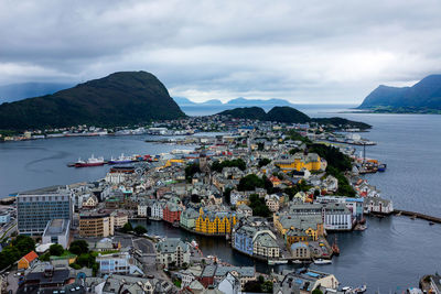 High angle view of bay and city against sky