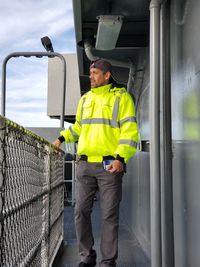 Full length of man standing in bus