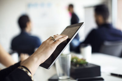 Close-up of businesswoman using digital tablet