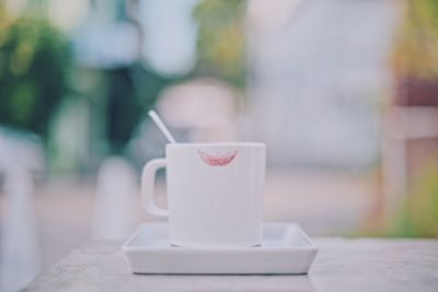 Close-up of coffee cup on table