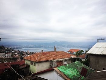 High angle view of town against cloudy sky