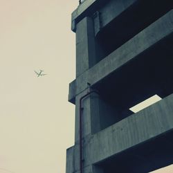 Low angle view of airplane flying in sky