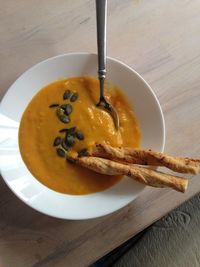 High angle view of breadstick in soup on table