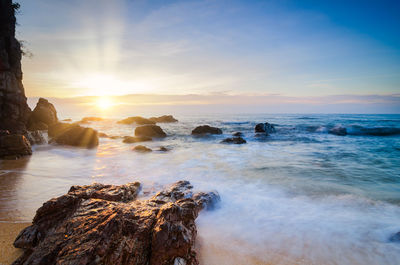 Scenic view of sea against sky during sunset