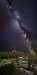 Scenic view of star field against sky at night