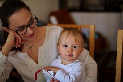 Close-up of mother and daughter at home