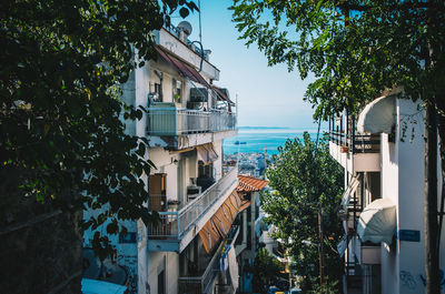 Buildings in town against clear sky