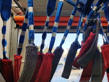 Close-up of multi colored umbrellas hanging in row