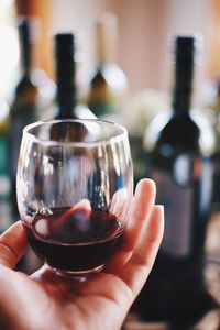 Close-up of hand holding wineglass