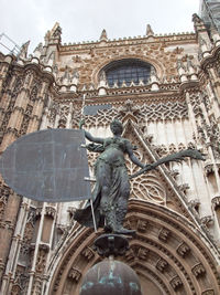 Low angle view of statue of historic building