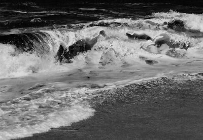 Waves splashing on rocks