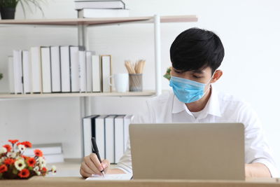 Man using laptop on table