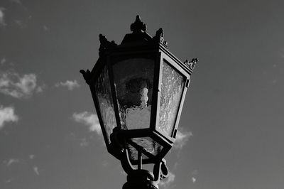 Low angle view of street light against sky