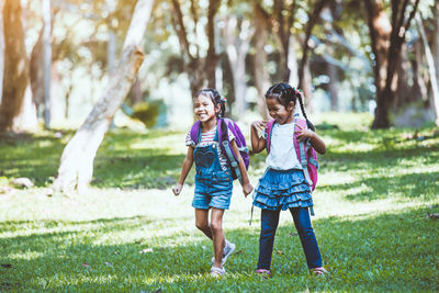 Full length of mother and daughter in park