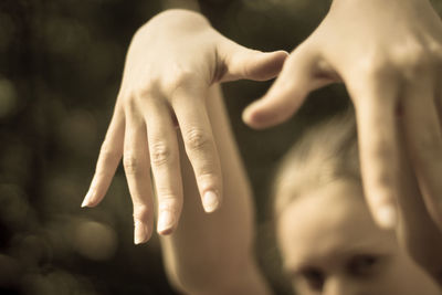 Close-up portrait of woman hands