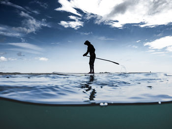 Woman jumping in water