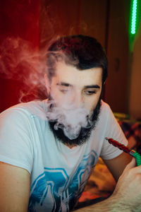 Close-up of man smoking hookah