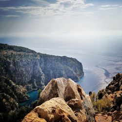 Scenic view of sea and rocks against sky