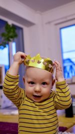 Portrait of cute boy with crown