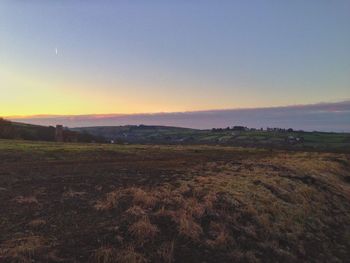 Scenic view of landscape at sunset