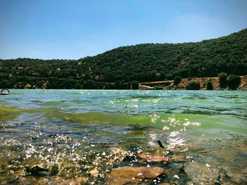 Scenic view of river against sky