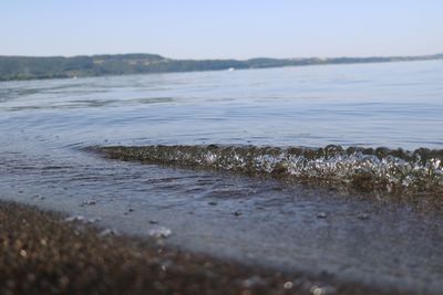 Surface level of sea shore against sky