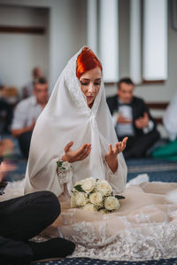 Midsection of woman wearing mask