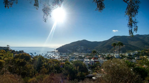 Panoramic view of sea and mountains against sky