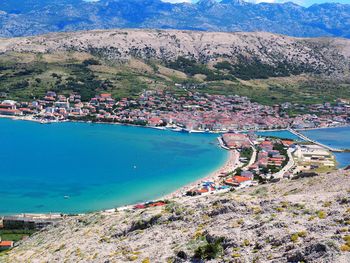 High angle view of sea and buildings in city