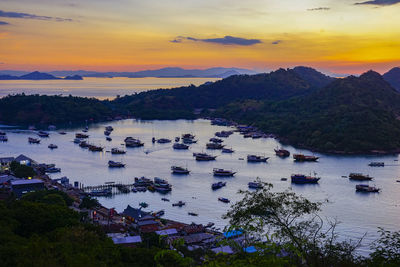 High angle view of sea against sky at sunset